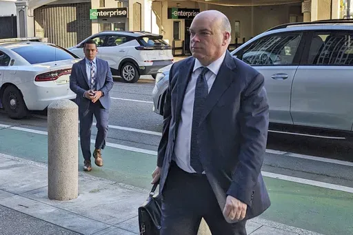 British tech magnate Mike Lynch walks into federal court in San Francisco, March 26, 2024, (AP Photo/Michael Liedtke, File)