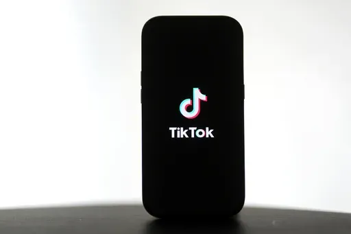 A TikTok logo is shown on a phone in San Francisco, Friday, Jan. 17, 2025. (AP Photo/Jeff Chiu)