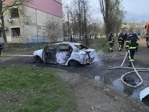 Rescue workers work on a site after Russian rocket strike on residential neighbourhood killing civilians including children, in Kryvyi Rih, Ukraine, April 4, 2025. (Na Chasi media via AP)