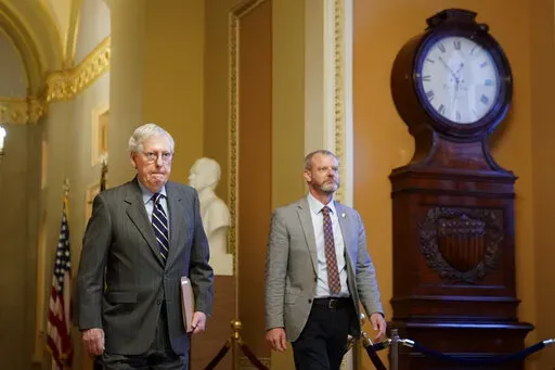 Senate Minority Leader Mitch McConnell of Ky., walks to the Senate Chamber on Capitol Hill in Washington, Thursday, June 9, 2022. (AP Photo/Patrick Semansky)