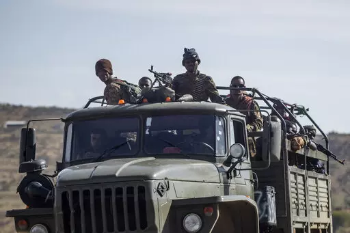 Ethiopian government soldiers ride in the back of a truck on a road near Agula, north of Mekele, in the Tigray region of northern Ethiopia on May 8, 2021. Authorities in Ethiopia's northern Tigray region alleged Wednesday, Aug. 24, 2022 that Ethiopia's military launched a "large-scale" offensive for the first time in a year, while Ethiopia's military spokesman did not immediately respond to questions. (AP Photo/Ben Curtis, File)