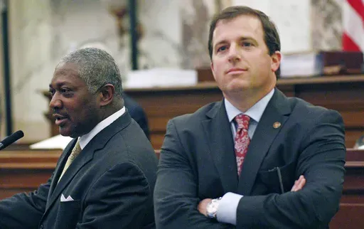 Sen. Josh Harkins, R-Flowood, right, reacts as Sen. John Horhn, D-Jackson, left, purposes amendments that would affect Harkins' proposed legislation that would shift control of the Jackson-Medgar Wiley Evers International Airport to state officials and surrounding counties, March 3, 2016, in Senate chambers at the Capitol in Jackson, Miss. (AP Photo/Rogelio V. Solis, File)
