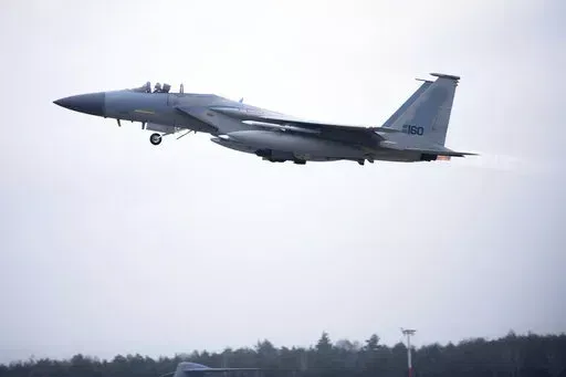 In this image provided by the U.S. Air Force, a U.S. Air Force F-15C Eagle assigned to the 493rd Fighter Squadron, Royal Air Force (RAF) Lakenheath, takes off in support of North Atlantic Treaty Organization enhanced air policing missions with the Polish Air Force at Lask Air Base, Poland, Feb. 15, 2022. Russia's attack on Ukraine's Zaporizhzhia nuclear power plant has renewed calls for NATO to impose a no-fly zone over Ukraine, despite the repeated rejection of the idea by western leaders conce
