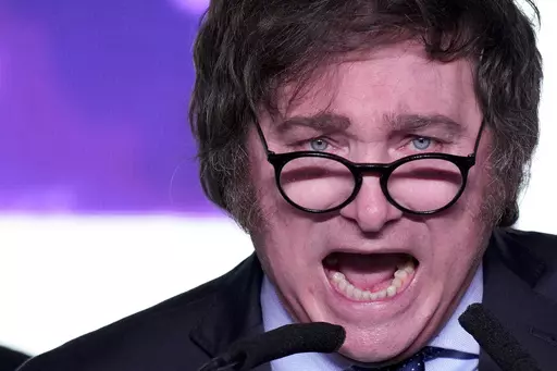 Javier Milei, presidential candidate of the Liberty Advances coalition, speaks at his campaign headquarters after polling stations closed during primary elections in Buenos Aires, Argentina, Sunday, Aug. 13, 2023. (AP Photo/Natacha Pisarenko)