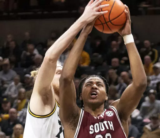 South Carolina's Collin Murray-Boyles, right, has his shot blocked by Missouri's Connor Vanover, left, during the first half of an NCAA college basketball game Jan. 13, 2024, in Columbia, Mo. South Carolina is No. 15 in the latest AP Top 25 poll for its first ranking in nearly seven years. (AP Photo/L.G. Patterson, File)