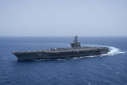 The USS aircraft carrier Dwight D. Eisenhower, also known as 'IKE', sails in the Red Sea on Wednesday, June 12, 2024. (AP Photo/Bernat Armangue, File)